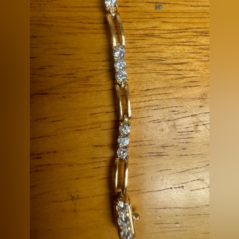 Roman Vintage cubic zirconia, gold tone bracelet, gold on it